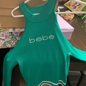 Woman’s light soft Bebe cut out shoulder sweater .. brand new never worn